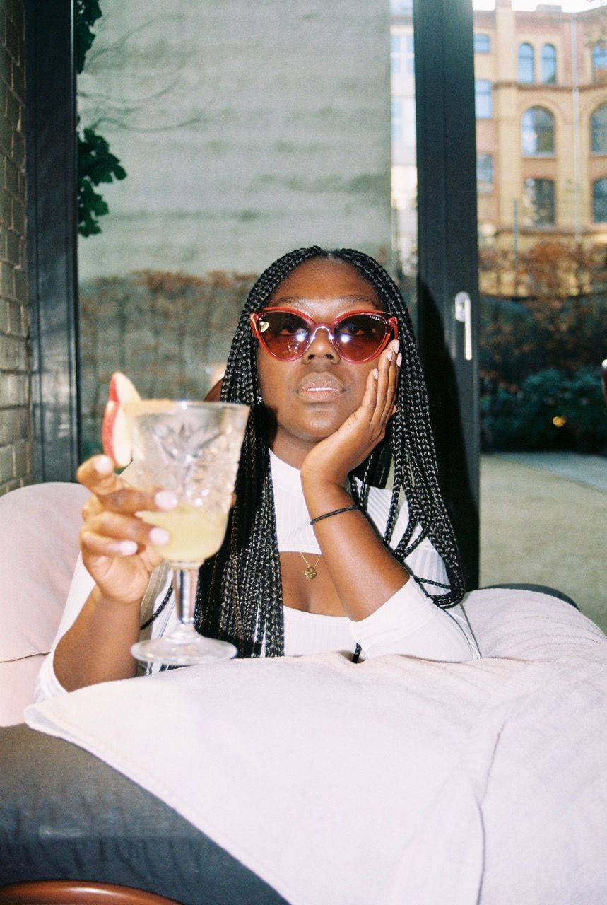 vogue eyewear lois opoku drinking cocktail